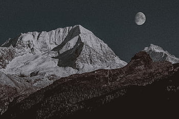 Breathtaking view of a majestic snow-capped mountain under a clear moonlit night sky. HD wallpaper