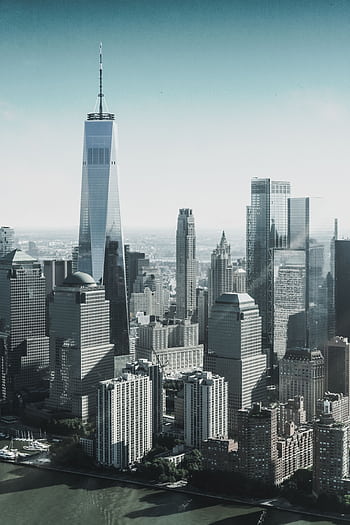 Breathtaking view of New York City's skyline featuring the iconic One World Trade Center. HD phone wallpaper
