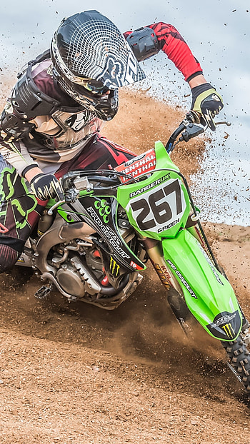 Muddy tracks, Gravity-defying stunts, High-speed race, Fierce competition HD phone wallpaper