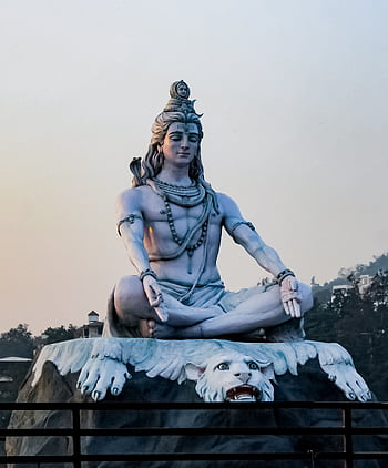 Stunning Lord Shiva statue in Rishikesh at dusk showcasing divine peace and serenity. HD phone wallpaper