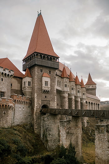 Explore the grandeur of Corvin Castle, a stunning medieval fortress in Romania. HD phone wallpaper