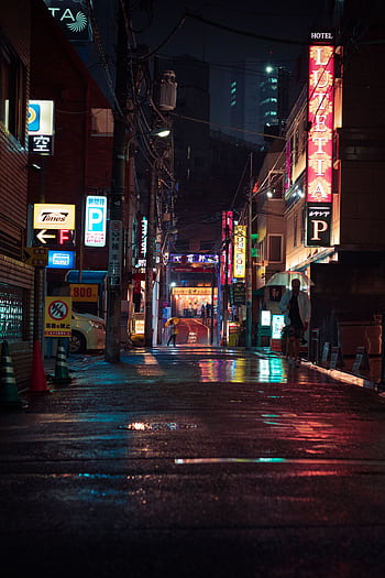 Explore the vibrant and illuminated neon streets of Tokyo at night, capturing the dynamic energy of the urban landscape. HD phone wallpaper