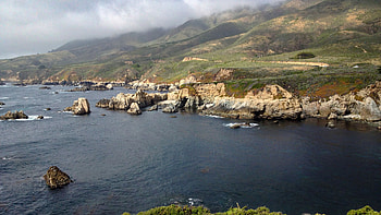Sea Rocks Mountains Slope Bushes Mist Sky Background Nature HD wallpaper