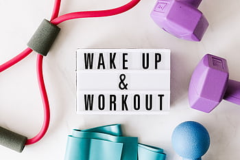 Flat lay of fitness equipment with a motivational slogan for exercise inspiration. HD wallpaper