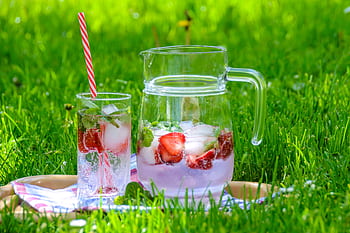 Chilled strawberry and mint refreshment on a picnic blanket outdoors in summer. HD wallpaper