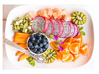 Vibrant tropical fruit platter with dragon fruit and more, shot from above. HD wallpaper