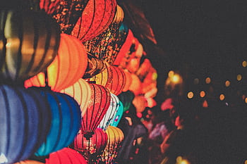 Vibrant multicolored lanterns illuminate the night, creating a festive and atmospheric scene. HD wallpaper