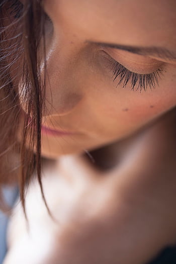 Close-up artistic portrait capturing a young woman's serene expression and natural beauty. HD phone wallpaper