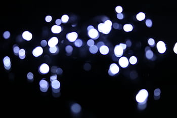 A captivating abstract bokeh light pattern captured at night, perfect for creative designs. HD wallpaper