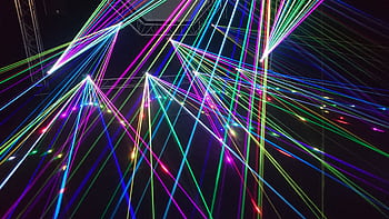 Dynamic multicolor laser beams create an electrifying display in a nighttime laser show. HD wallpaper