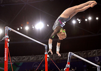 Uneven bars promotions, Gymnastics apparatus, Graceful routine, Athletic excellence HD wallpaper