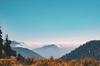 A scenic view of mountains and clouds in Coachella, CA, capturing nature's serenity. HD wallpaper