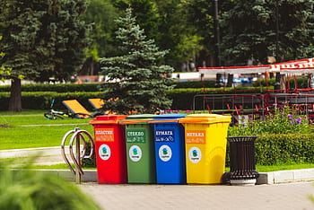 Colorful recycling bins for waste segregation in a Moscow park. HD wallpaper