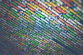 Vibrant multicolored source code displayed on a computer screen, depicting programming and web development concepts. HD wallpaper