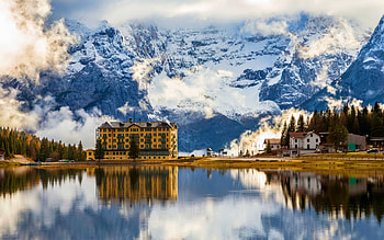 Lake Misurina, island, winter, peaks, reflection, snow, water, majestic, snowy, slope, hotel, landscape, beautiful, lake, mountain, cliffs, clouds, nature HD wallpaper