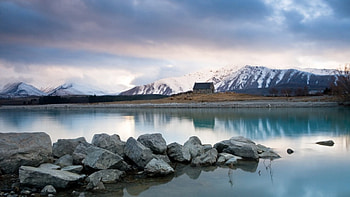 A glacier's lake, scene, alone, house, landscape, , stones, glacier, lakes, reflection, light, clouds, nature, sky, mountains, water HD wallpaper