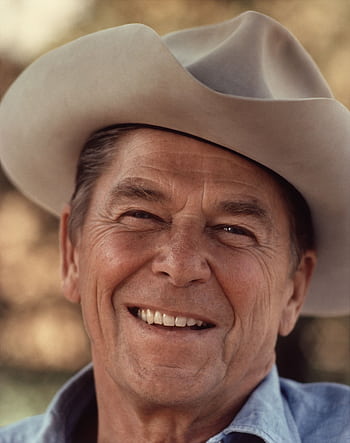 Portrait of a senior man wearing a cowboy hat, smiling warmly outdoors. HD phone wallpaper