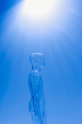A transparent human figure under a bright blue light creating a futuristic ambiance. HD phone wallpaper