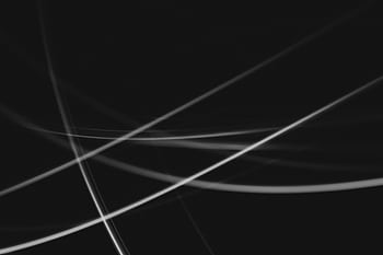 Dynamic abstract black and white light streaks, perfect for modern backgrounds and graphic design. HD wallpaper