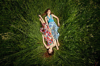 Two sisters, sexy, plants, printed dress, girl, beautiful, grass, dress, beauty, woman, , lovely, , female HD wallpaper