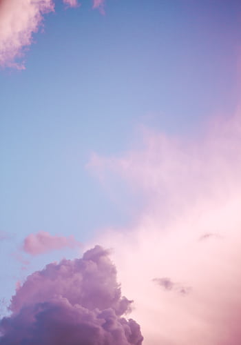 A breathtaking view of a vibrant pink and blue sky with soft clouds in Berlin. HD phone wallpaper
