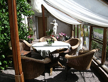 Relaxing Place, chairs, table, staue, plant, flowers, cloth HD wallpaper