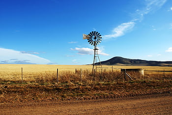 Scenic view of a windmill in a rural field outside Cape Town, South Africa. HD wallpaper