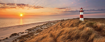 Glasbild Lighthouse, Sunset glow, Majestic coastal view, Tranquil atmosphere HD wallpaper
