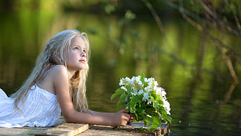 Cute Little Girl Is Lying Down On Wood Floating Board With White Flowers Looking Up Wearing White Dress Cute HD wallpaper