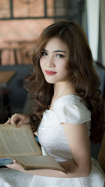 Elegant Brunette Woman with Brown Eyes Reading in White Dress, book, brown eyes, brunette, model, white dress, woman, asian HD phone wallpaper