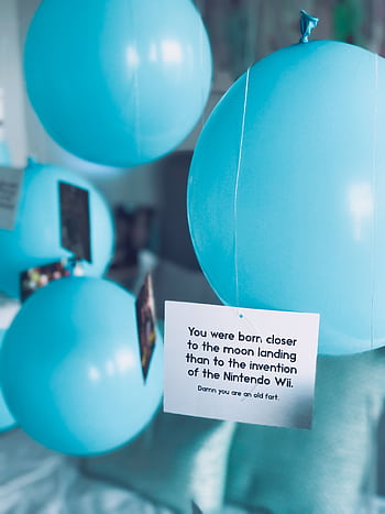 Pastel blue balloons with a humorous birtay card, perfect for a fun and festive celebration theme. HD phone wallpaper