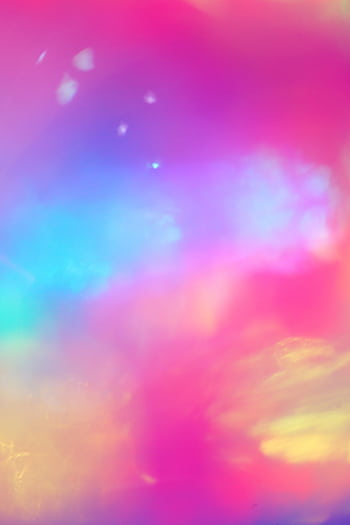 A dreamy, colorful abstract cloudscape with pastel rainbow hues evokes a fantasy landscape. HD phone wallpaper