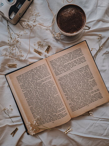 A serene flat lay featuring an open book, coffee, dried flowers, and clothespins. HD phone wallpaper