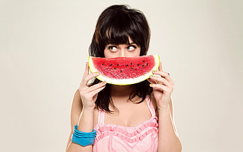 Katy Perry and watermelon, Playful smile , delight, Pop star appreciation HD wallpaper