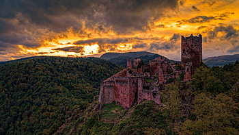 Hills and castle, sunset HD wallpaper