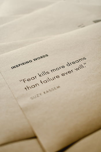 Motivational quote on brown paper emphasizing overcoming fear. HD phone wallpaper