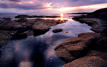 Sunset, rays, sea, sunlight, colors, rocks, reflection, clouds, nature, sky, ocean HD wallpaper
