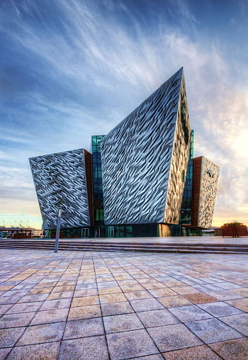 Impressive modern design of the Titanic Belfast museum, showcasing unique architectural style. HD phone wallpaper