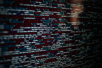 Detailed of computer source code displayed on a screen, showcasing web development elements. HD wallpaper