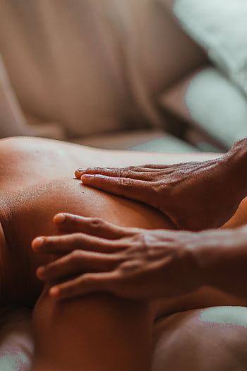A soothing back massage session in a spa setting, focusing on wellness and relaxation. HD phone wallpaper
