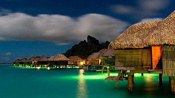 Night on the Island of Bora Bora, island, bungalow, stars, bora, roof, lights, clouds, nature, sky HD wallpaper