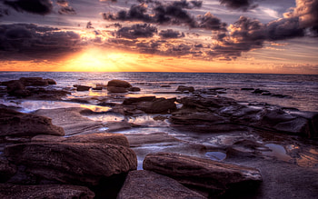 Sunrise, rays, sunlight, colors, rocks, purple, waves, clouds, nature, sky HD wallpaper