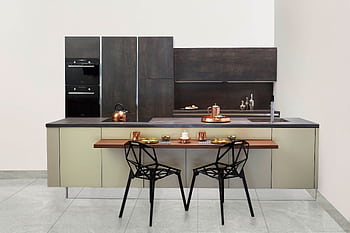 Elegant modern kitchen featuring copper accents and minimalist design. HD wallpaper
