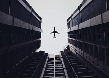 Airplane Flying Above The Buildings , planes, buildings HD wallpaper