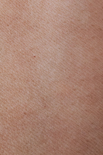 Detailed macro shot of human skin showing natural texture and coloration. HD phone wallpaper