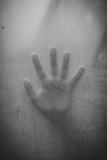 Abstract black and white of a handprint against foggy glass, evoking mystery and intrigue. HD phone wallpaper