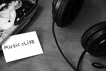 Close-up of heads and a note saying 'Music = Life', perfect for music lovers and backgrounds. HD wallpaper