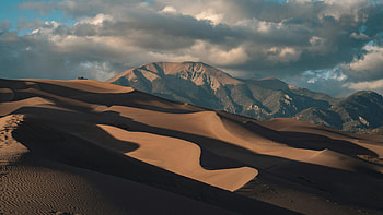 Sand Dunes Nestled In Mountain Valley, dunes, view, nature, desert, sunset, sky, clouds HD wallpaper
