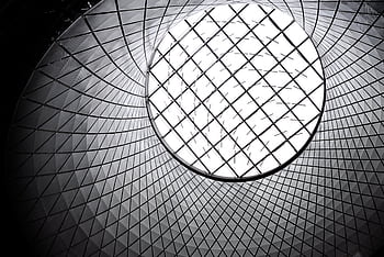 Worm's eye view of a futuristic geometric skylight showcasing modern architecture. HD wallpaper
