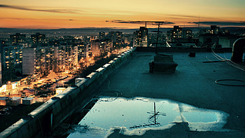 Coming to Life, blue, sunny, rooftop, cars, buildings, roof, puddle, day, skyscrapers, reflection, streets, sun, sunset, grey, city, people, orange, life, lights, yellow, clouds, sky HD wallpaper